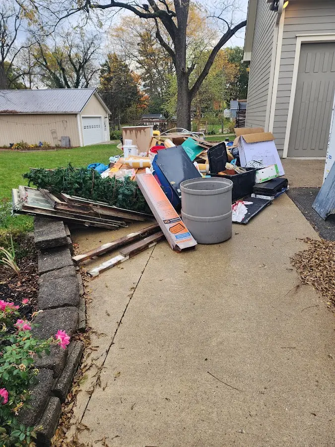 Dumpster being loaded with debris for Commercial Dumpster Rental in Bellmawr